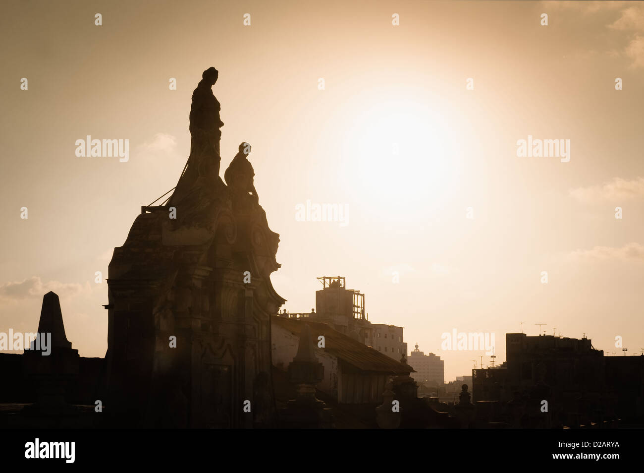 Silhouette of statues on ornate building Stock Photo
