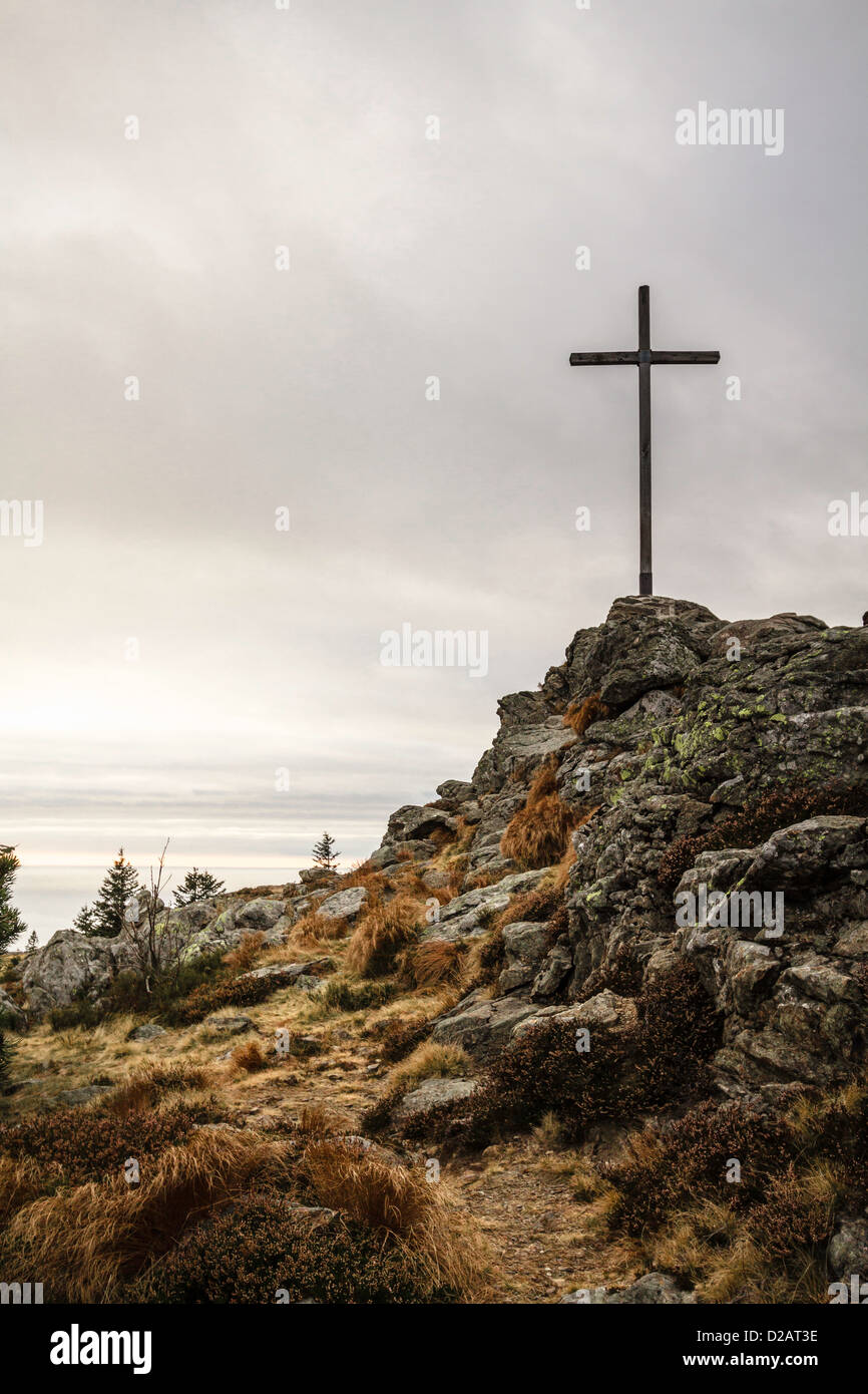 Cross on rocky hilltop Stock Photo