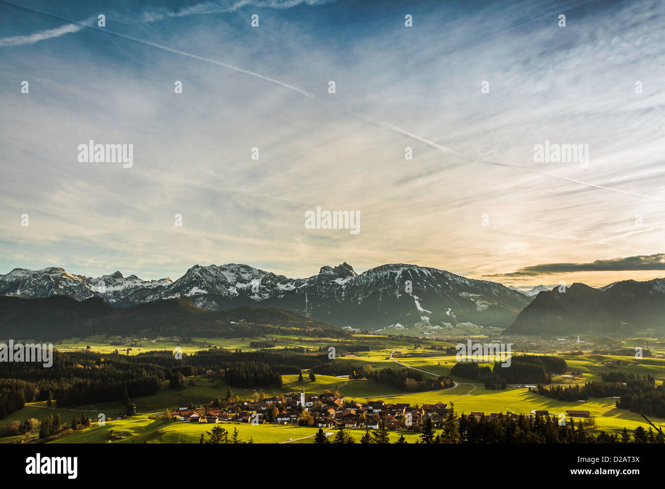 Aerial view of village and mountains Stock Photo