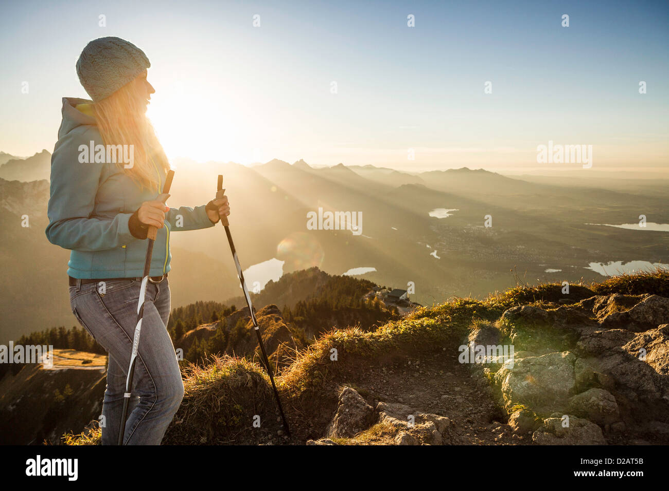 Hiker standing on rocky hilltop Stock Photo