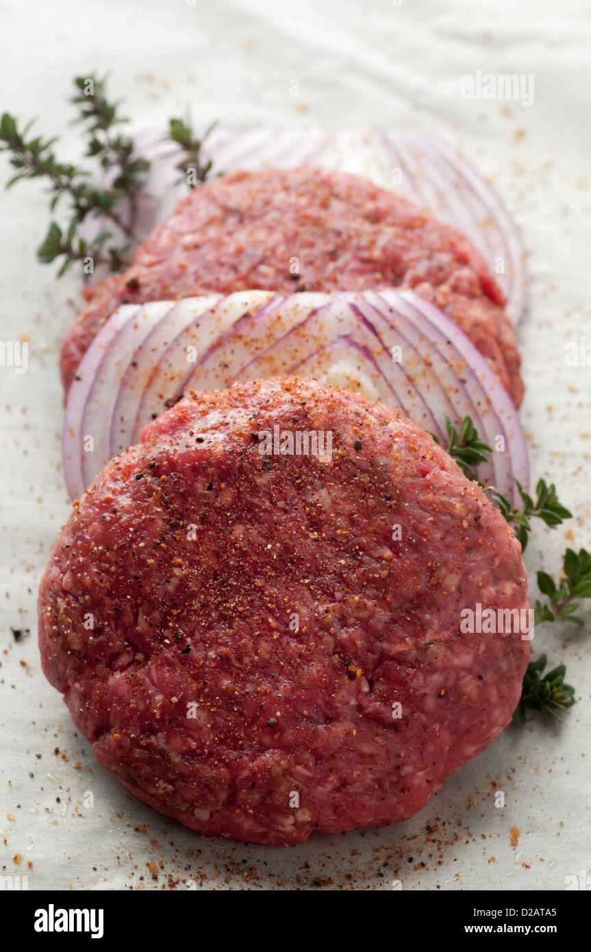 Fresh grass fed ground beef with onion and seasoning Stock Photo