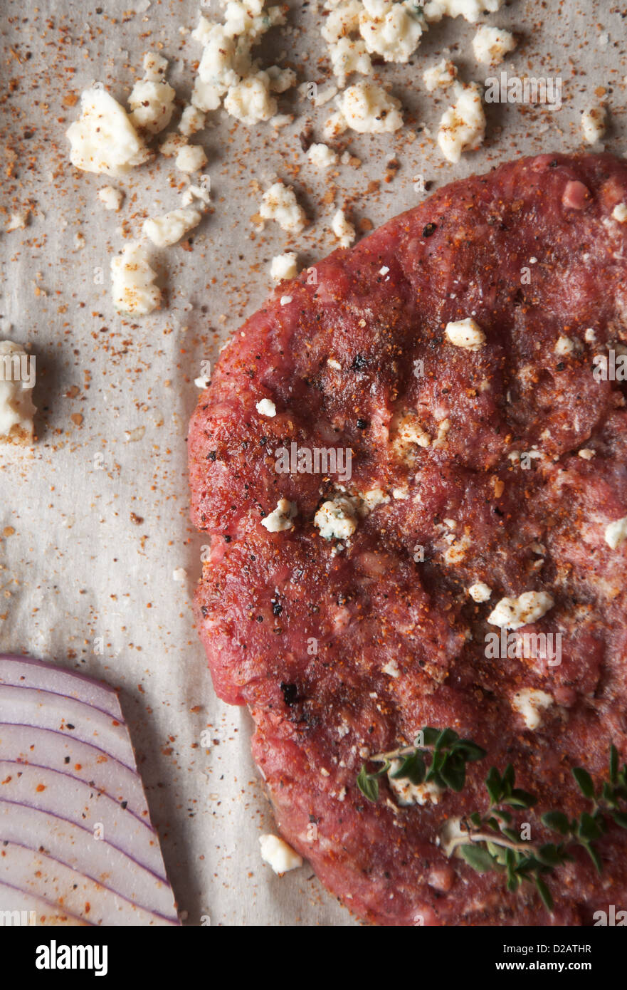 Fresh ground beef patty with cheese and seasoning Stock