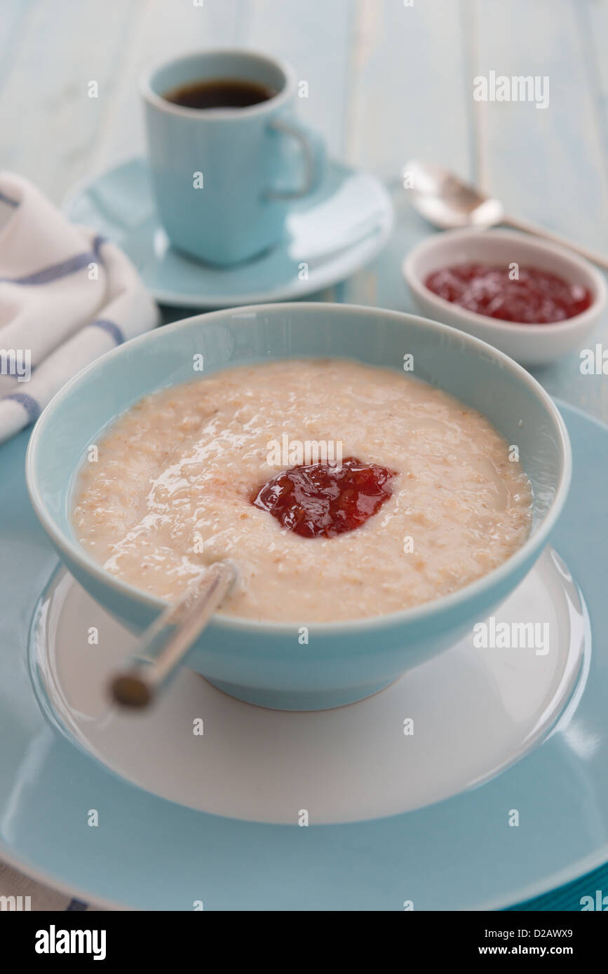 Porridge at breakfast, with coffee and jam. Stock Photo