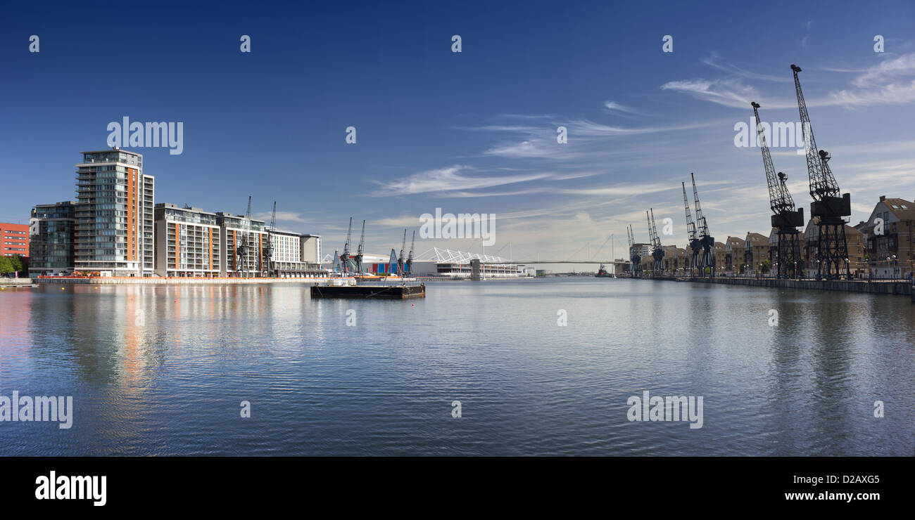 Wide view looking east across the water of the Royal Victoria Dock basin, in London's Docklands. Stock Photo