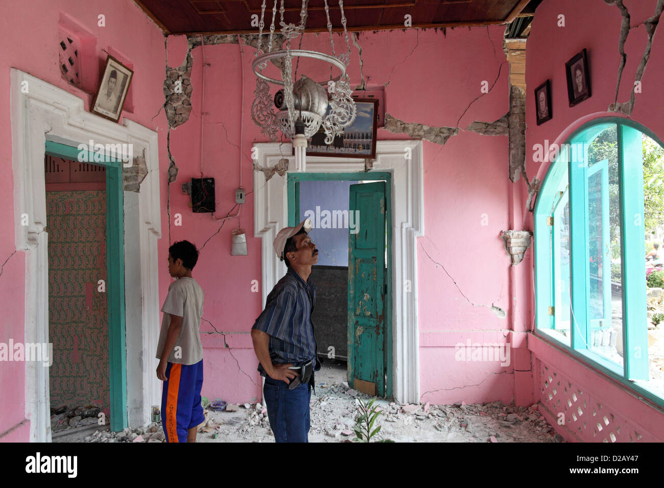 Pariaman, Indonesia, owners survey the damage to their house Stock Photo