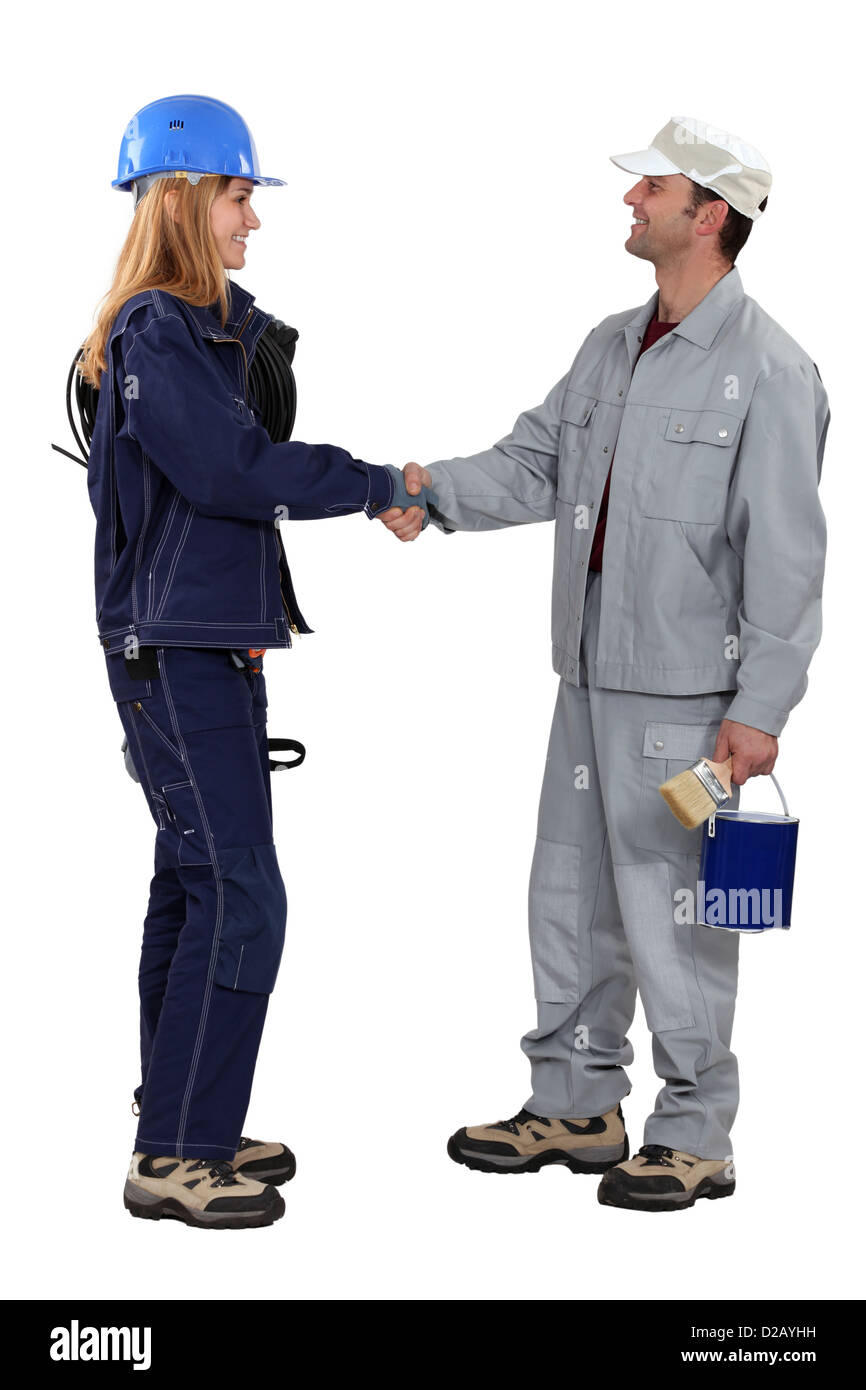 A painter and an electrician shaking hands Stock Photo Alamy