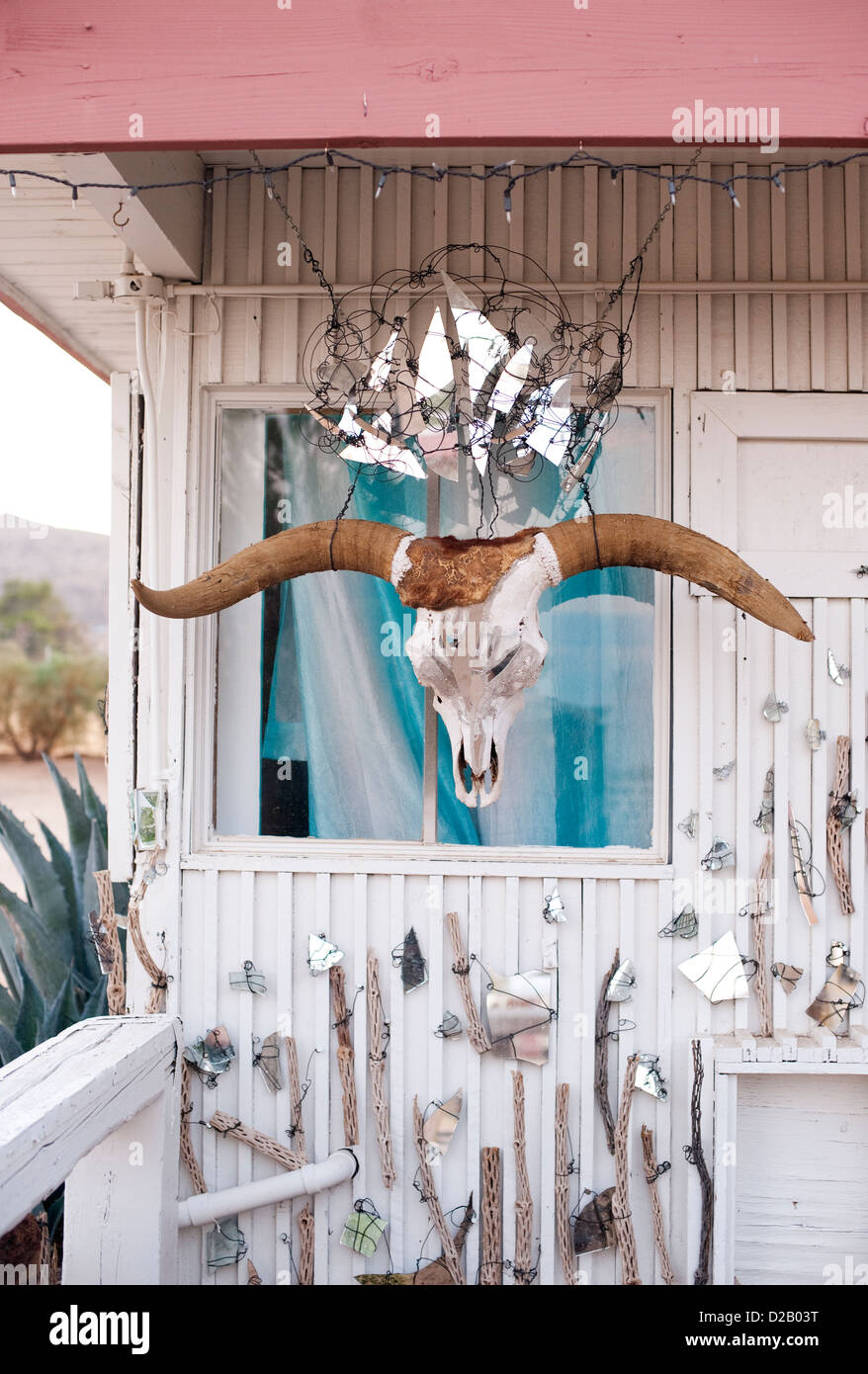 An eccentric southwestern dwelling with a mirror crowned cow skull. Stock Photo