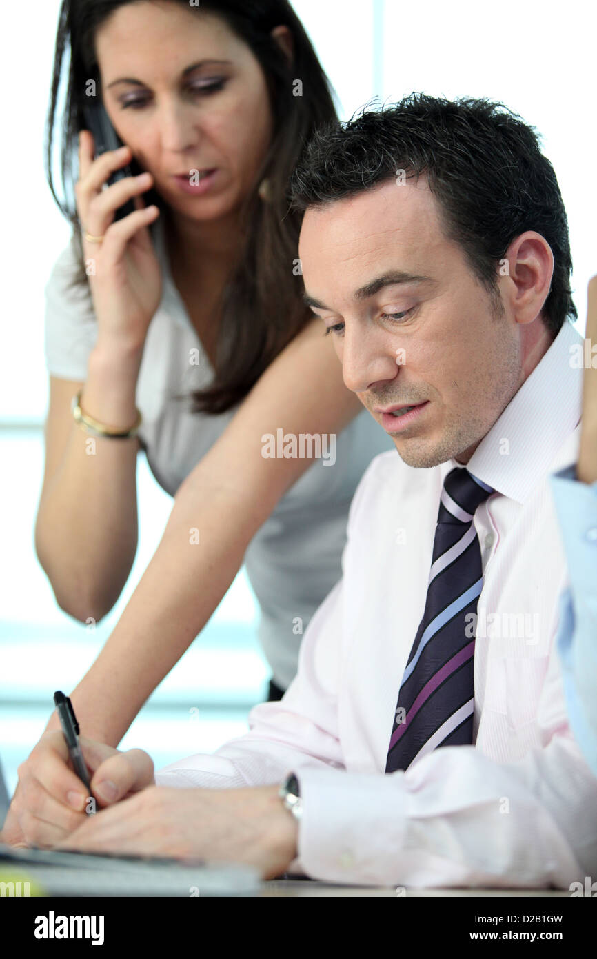 Male and female business colleague Stock Photo - Alamy
