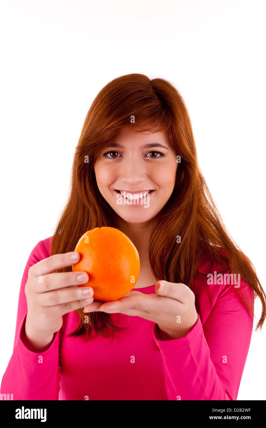 Young woman with orange in hand Stock Photo