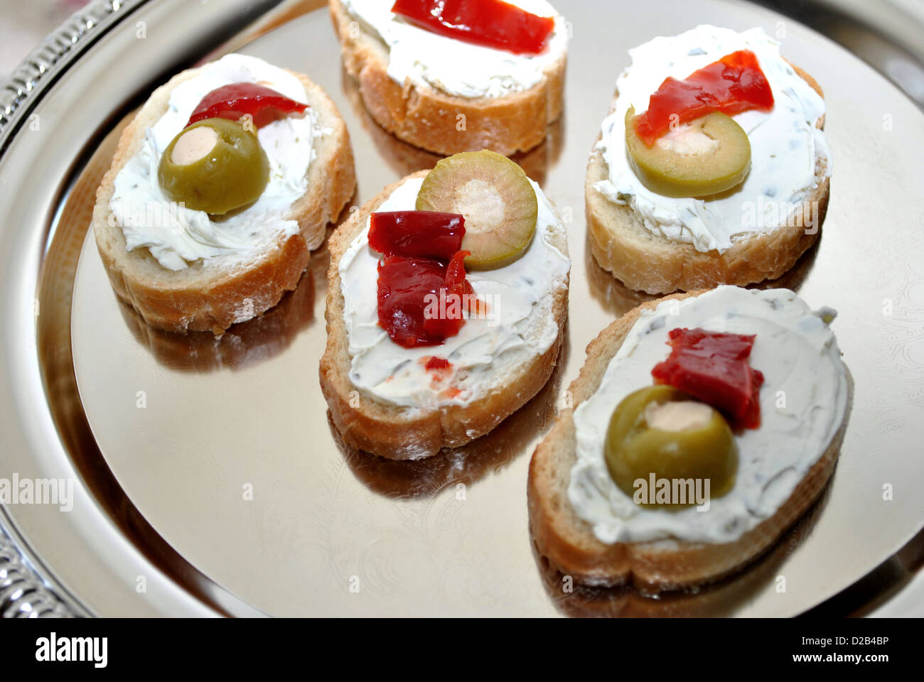 Appetizer; Creamy Cheese with Green Olives and Red Pepper Stock Photo