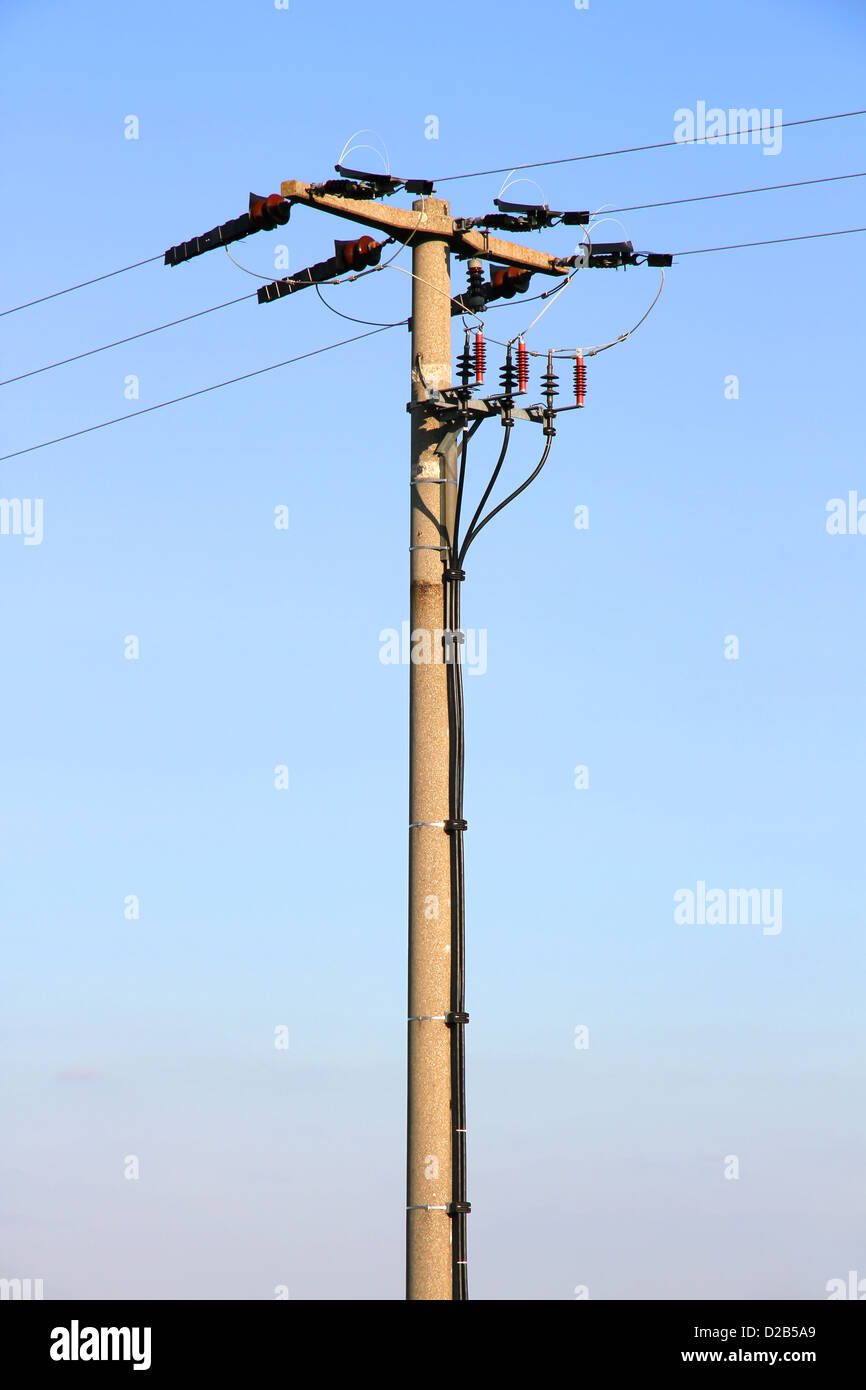Power lines in front of a blue sky Stock Photo - Alamy