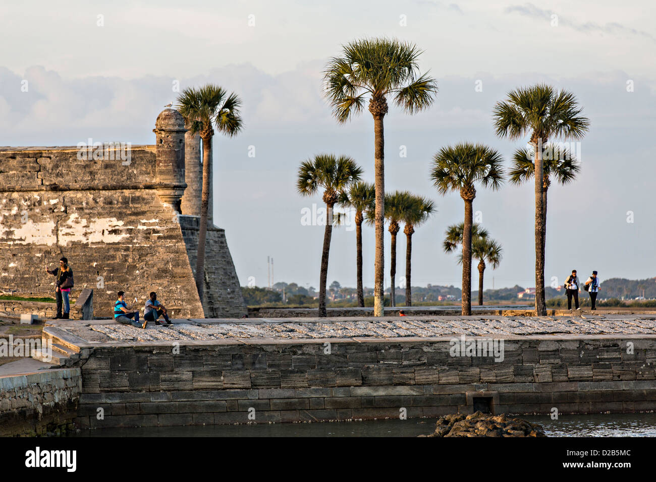 People look out at Matanzas Bay from the walls of the Castillo de San Marcos in St. Augustine, Florida. Stock Photo