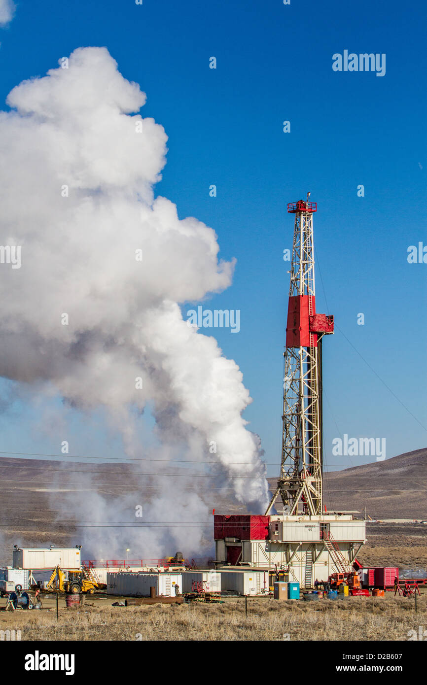 A drilling rig with a steam plume in the High Desert town of Fernley