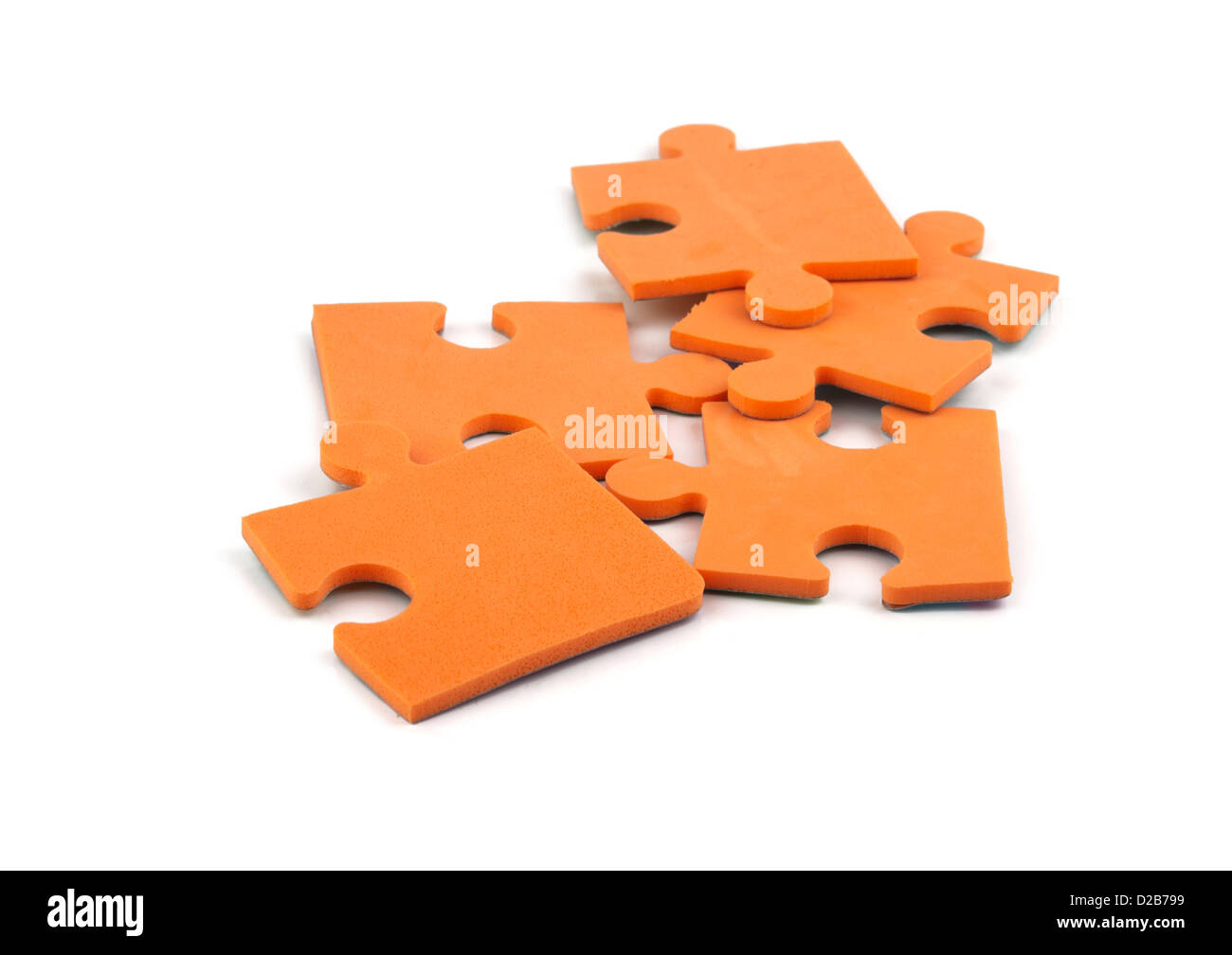 orange jigsaw puzzle pieces Stock Photo
