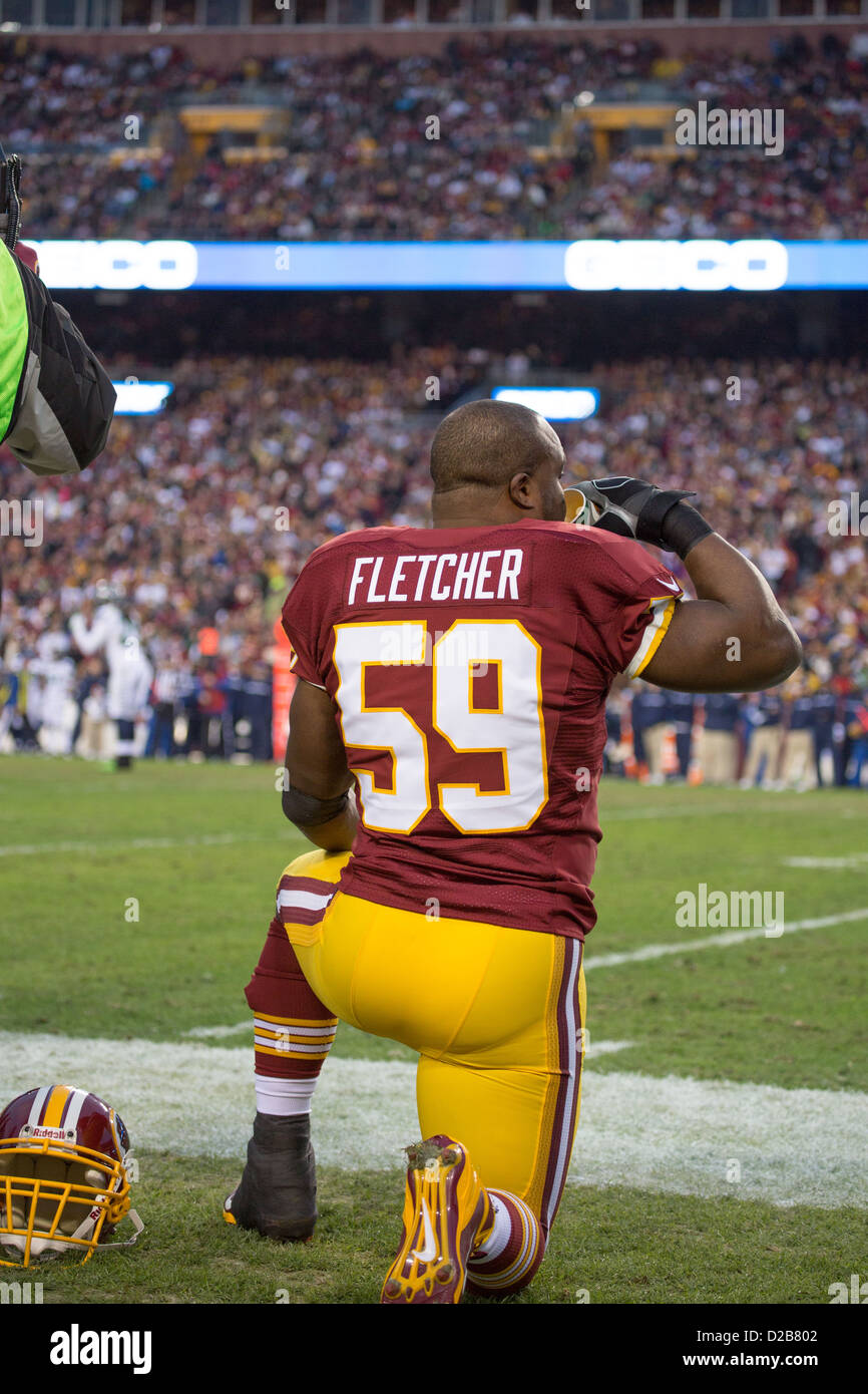 January 6th 2013, Washington Redskins, London Fletcher (59) sits on the sideline watching the offense on the sideline. Stock Photo