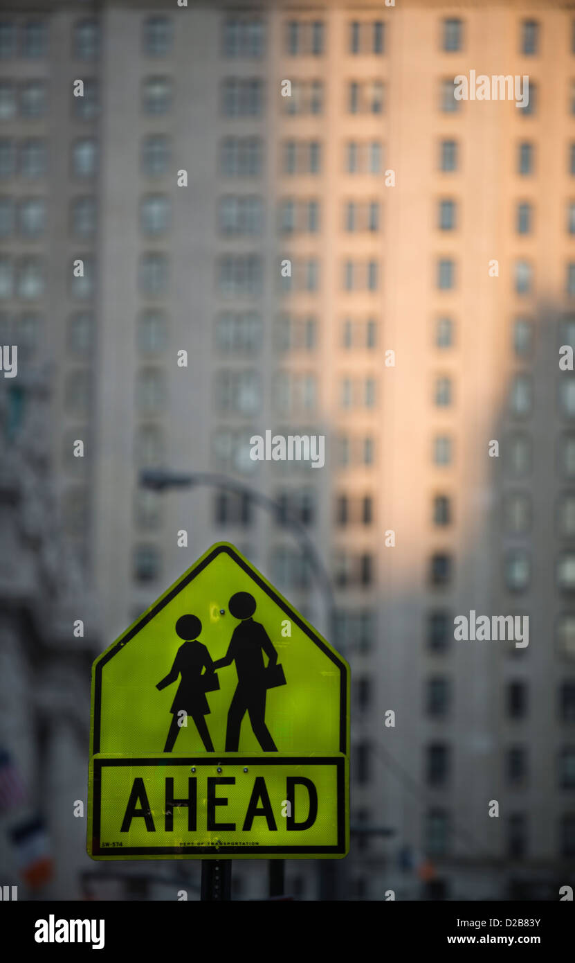 Pedestrian sign in New York City with office building as backdrop. Stock Photo