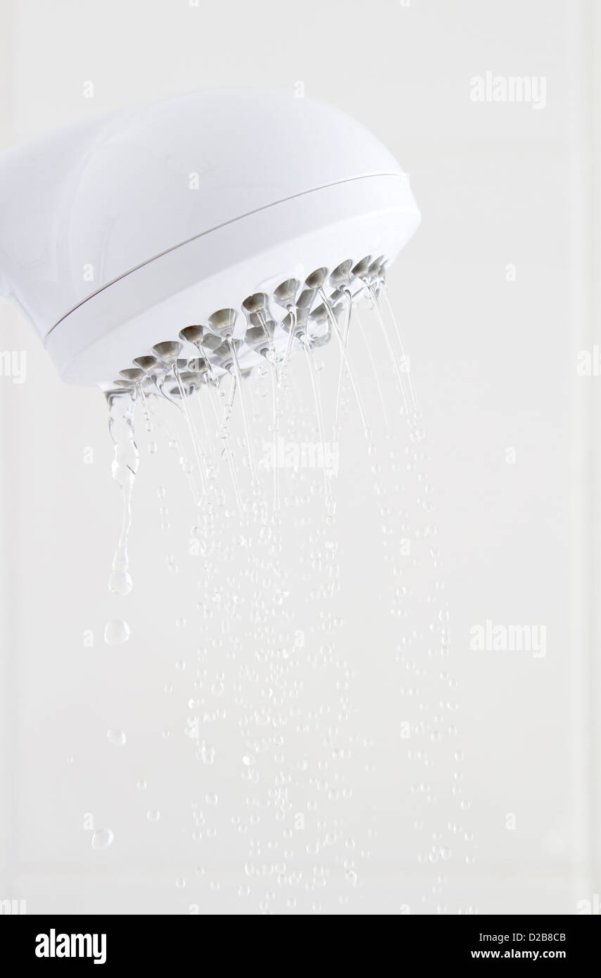 Water flowing slowly from white plastic shower head Stock Photo Alamy