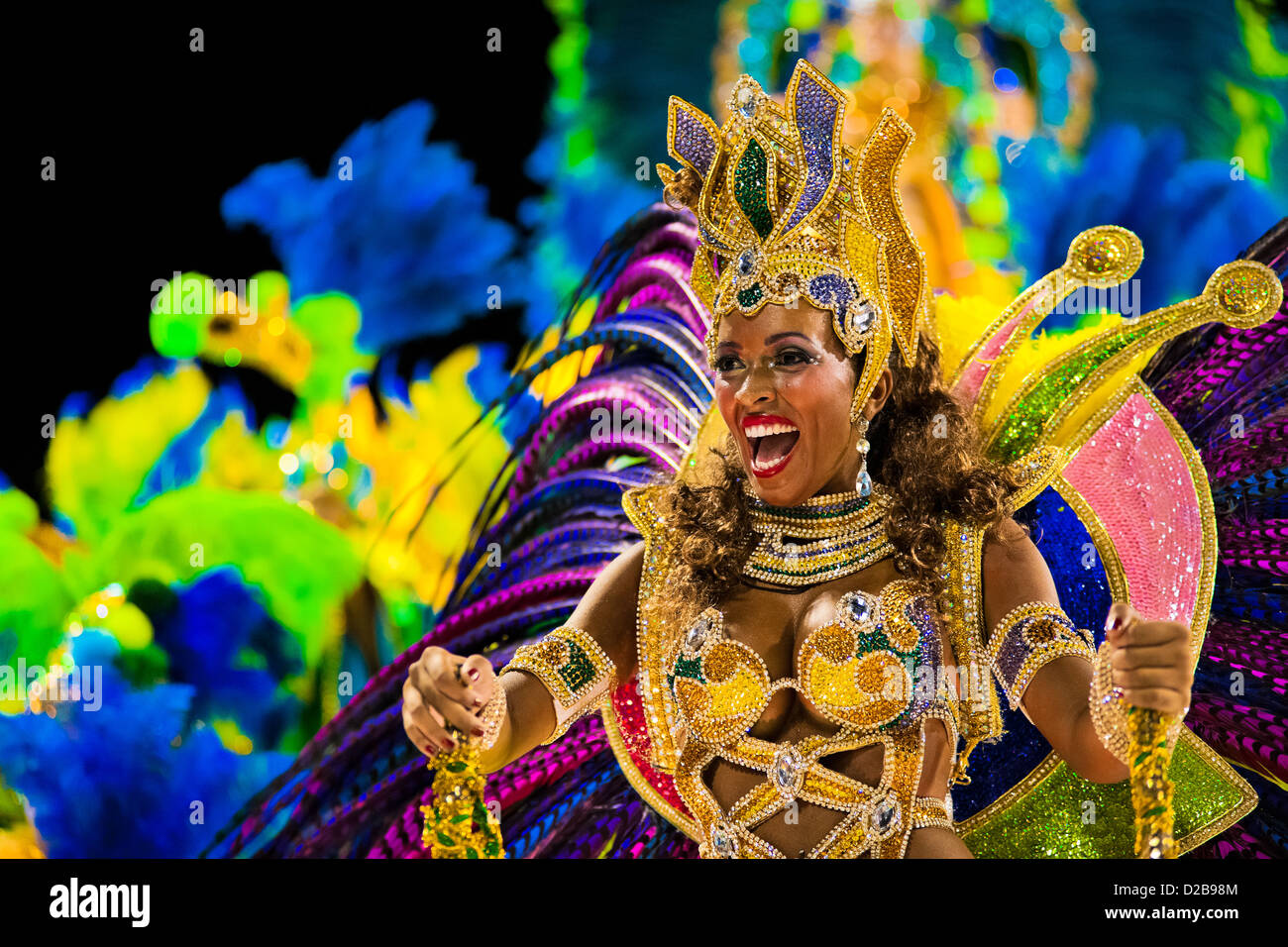 A dancer of Imperatriz samba school performs atop a float during the Carnival parade in Rio de Janeiro, Brazil. Stock Photo