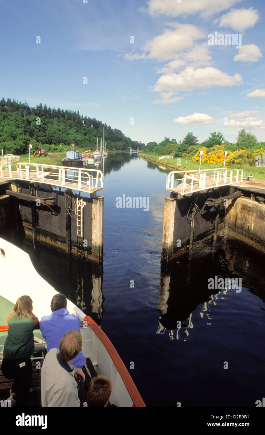 United Kingdom, Scotland. People In Boat Waiting For Lock To Open. Stock Photo
