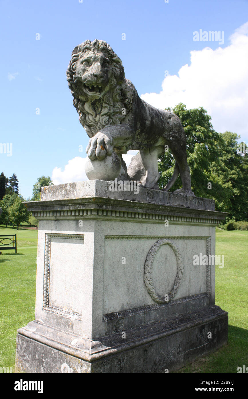 Stone statue of a male lion in the grounds of Kedleston Hall Derbyshire Stock Photo