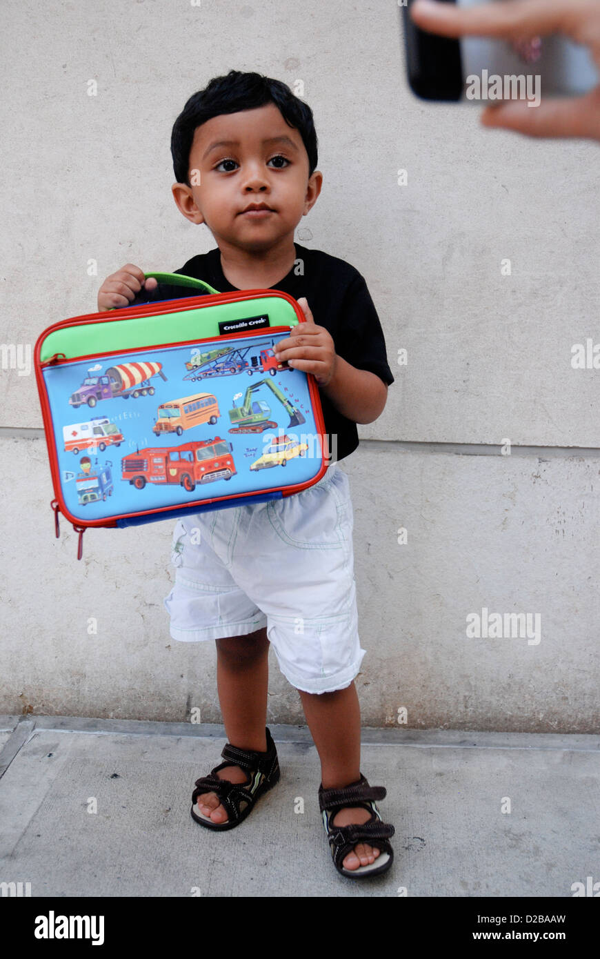 3 Year Old Boy With Lunch Bag In New York City. Stock Photo