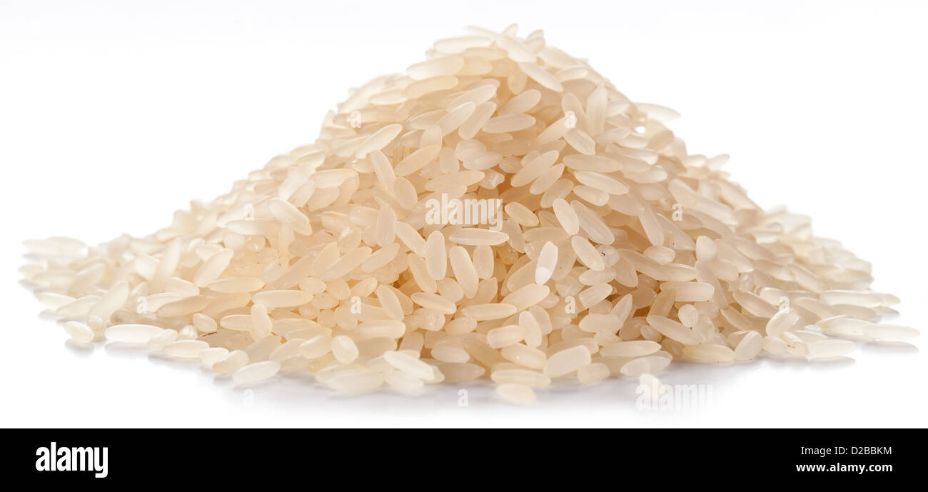 Handful of rice on a white background. Stock Photo