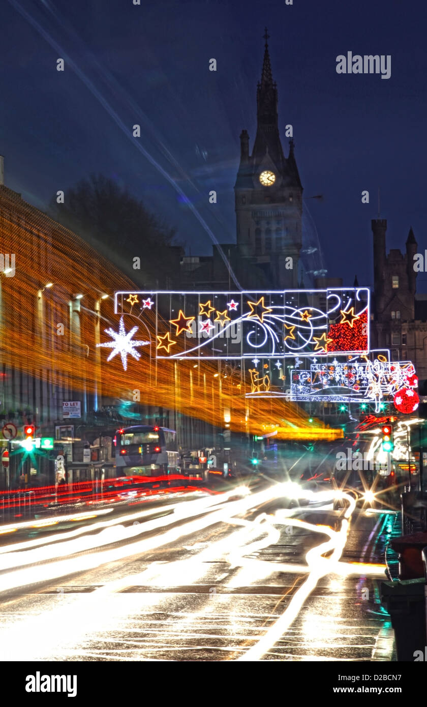 Festive Christmas Lights in Aberdeen city centre's Union Street, Scotland, UK with traffic light blurs Stock Photo