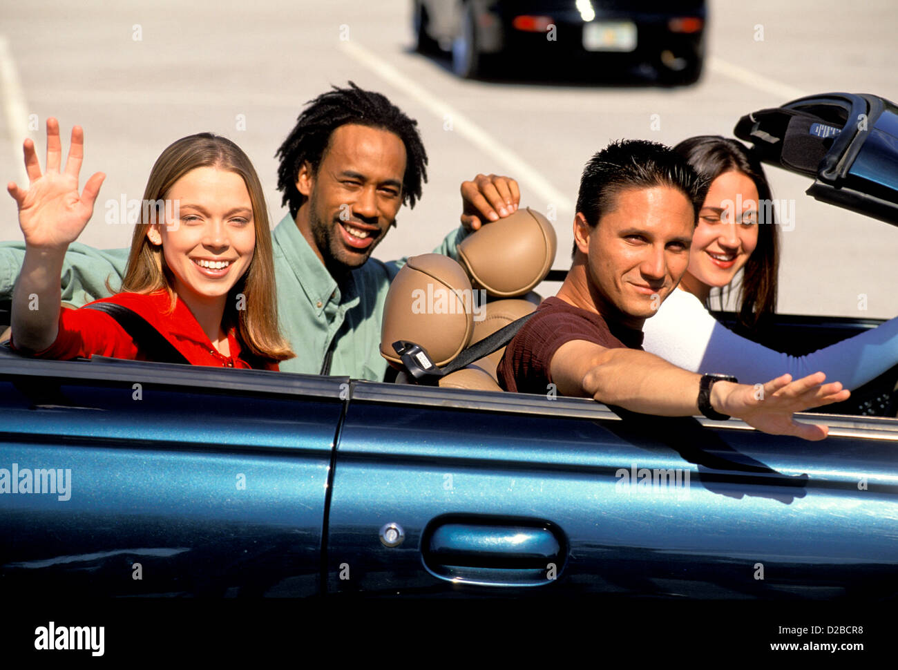 Four Teens And Young Adults In Convertible. Stock Photo