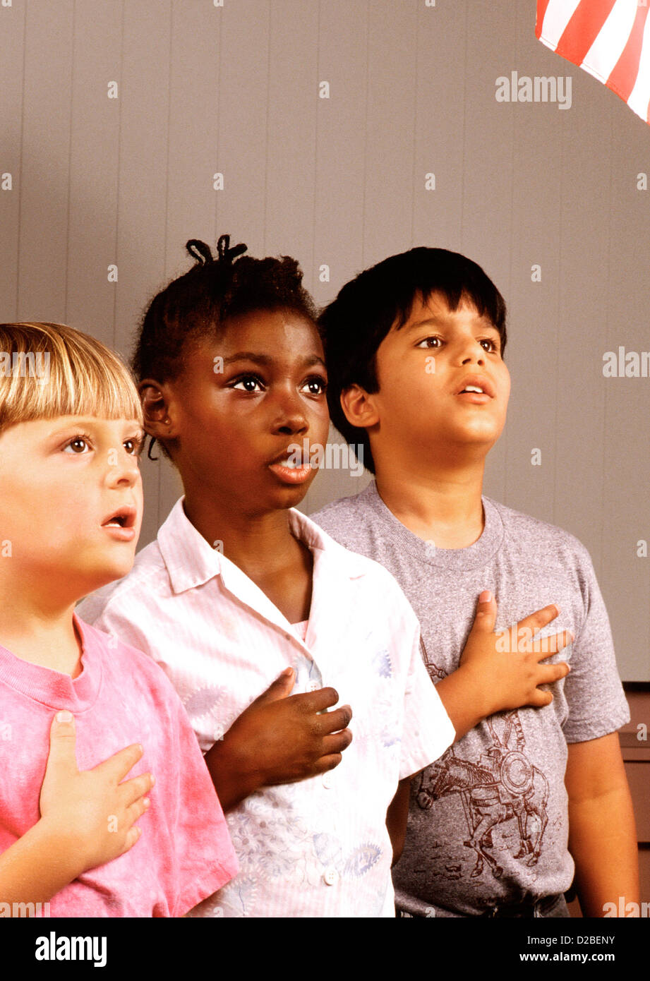 Elementary School Students Reciting The Pledge Of Allegiance Stock