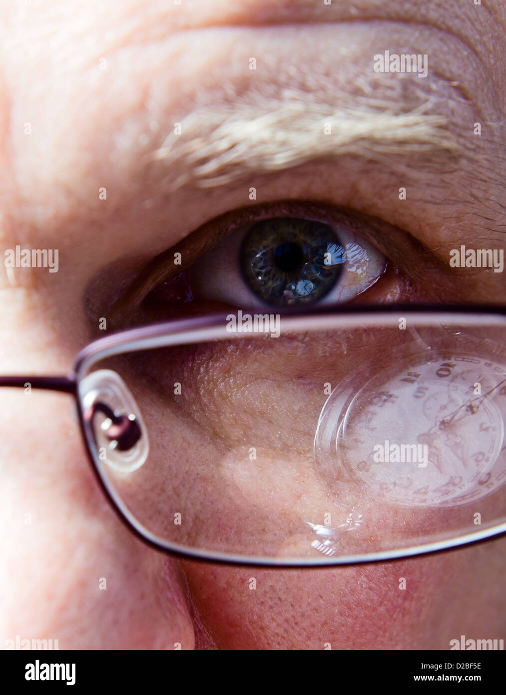 Eye of the businessman, natural reflexion in eyes and glasses Stock Photo