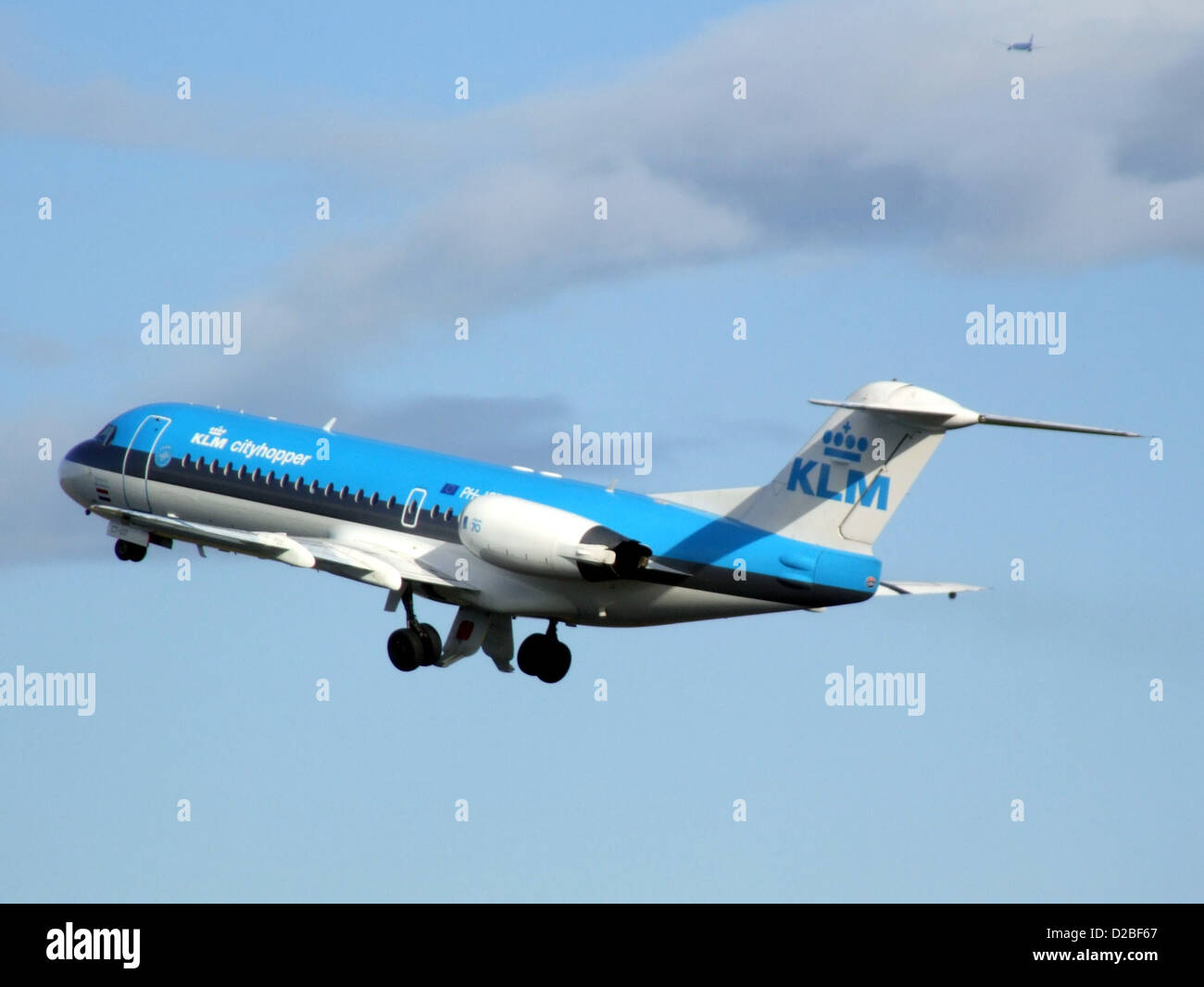 The KLM Cityhopper Fokker 70 is a regional jet, known for its versatility in short to medium-haul flights. Part of the KLM Cityhopper fleet, this aircraft operates primarily on European routes, offering efficient service for both business and leisure travelers. Stock Photo