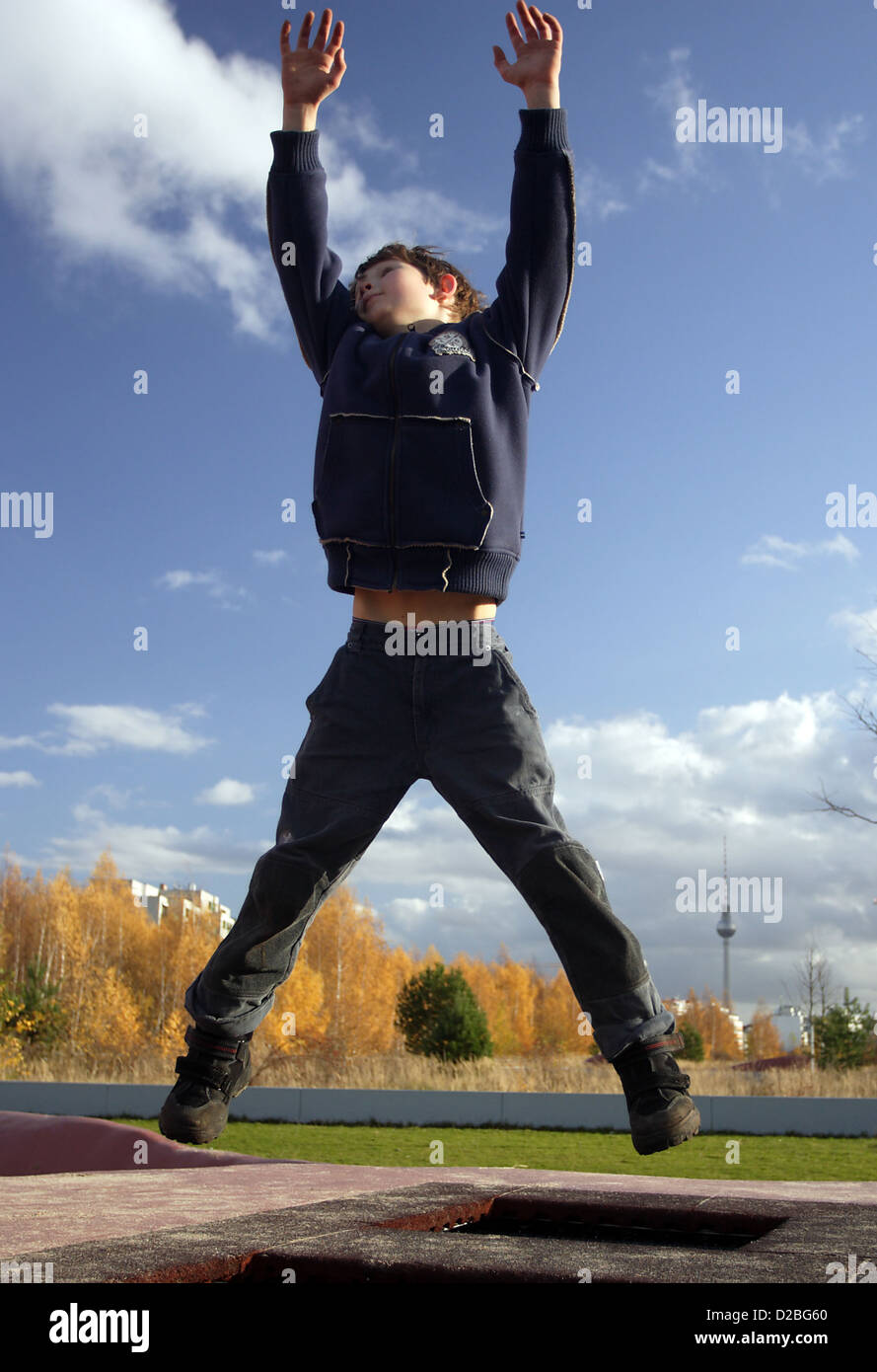 Berlin, Germany, dreamy boy jumping in the air Stock Photo