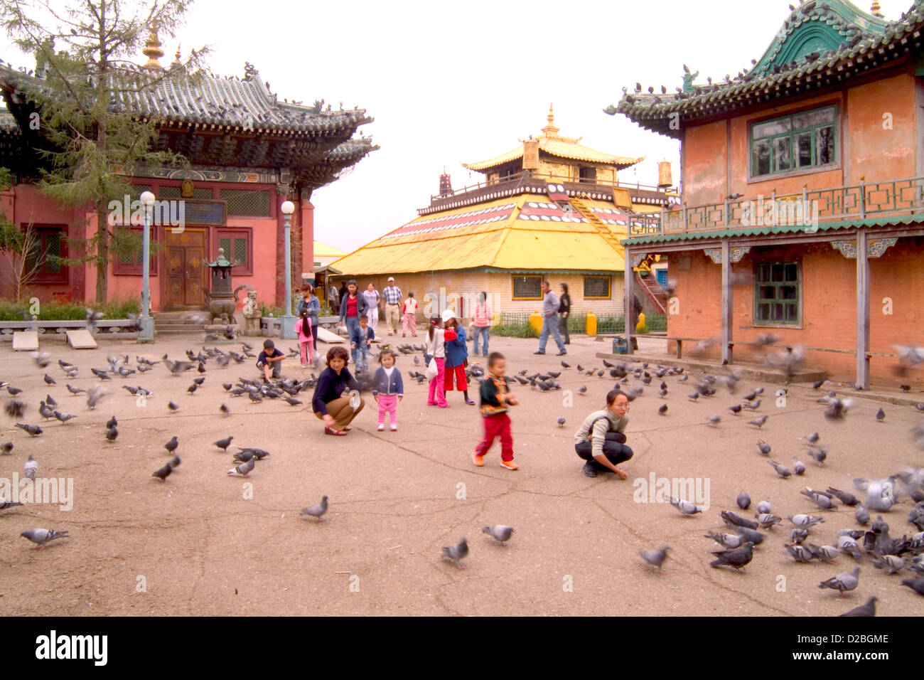 Mongolia, Ulaan Baatar, Family Feeding Pigeons Stock Photo