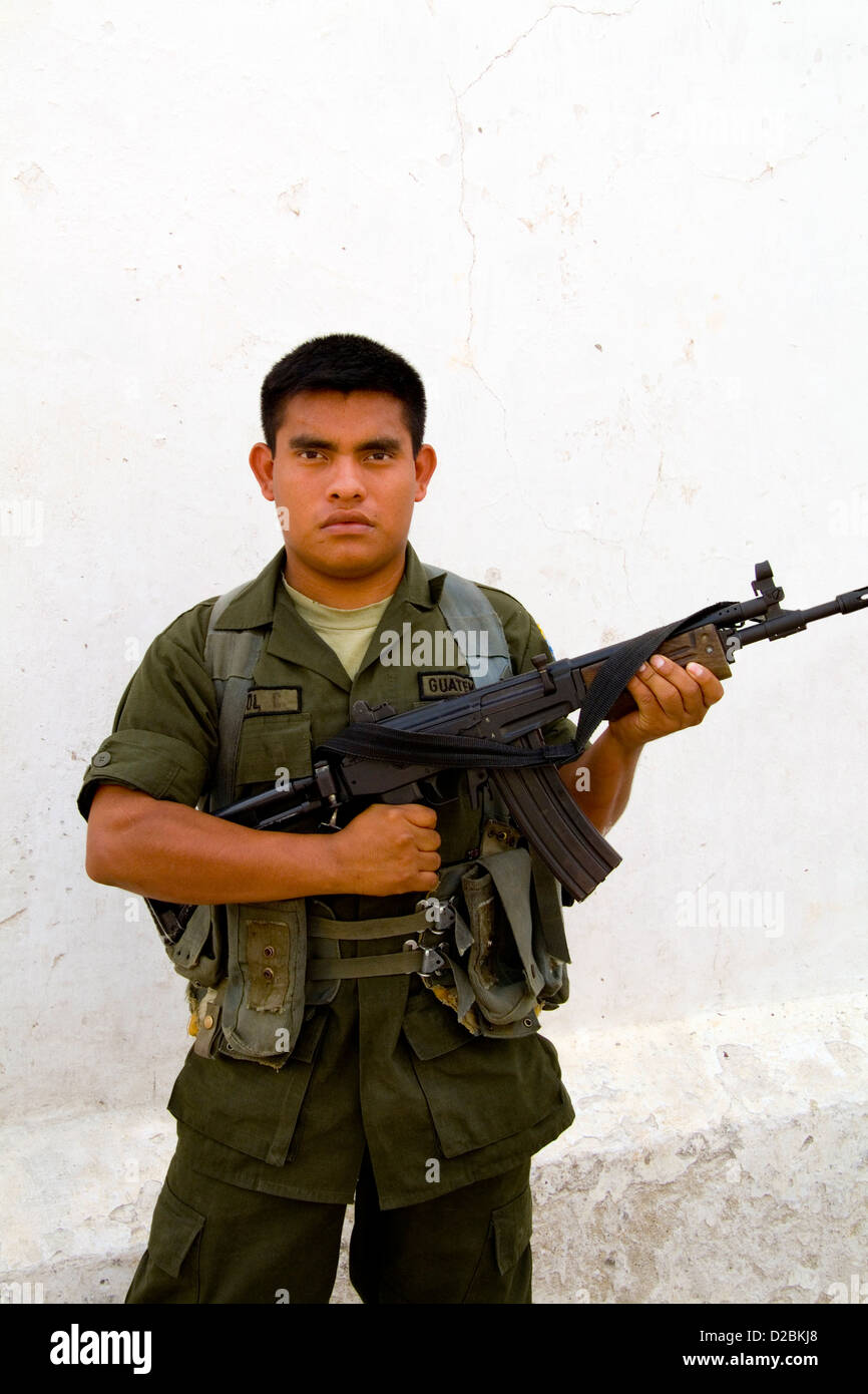Guatemala, Village Of Flores. Armed Soldier Stock Photo