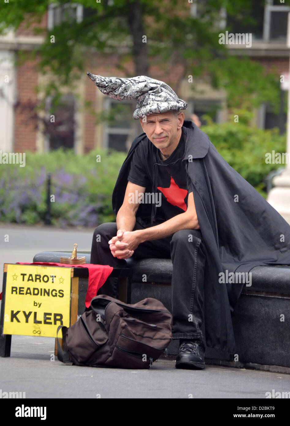 Tarot card reader Kyler in Washington Square Park in Greenwich Village, New York City Stock Photo