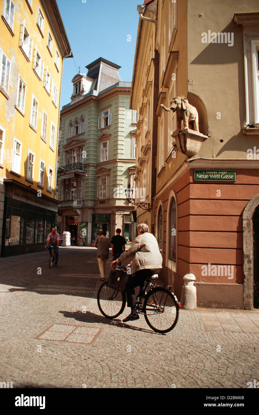 Austria, Graz, Medieval Quarter, Neue-Welt-Gasse. Bicyclist In Street. Stock Photo