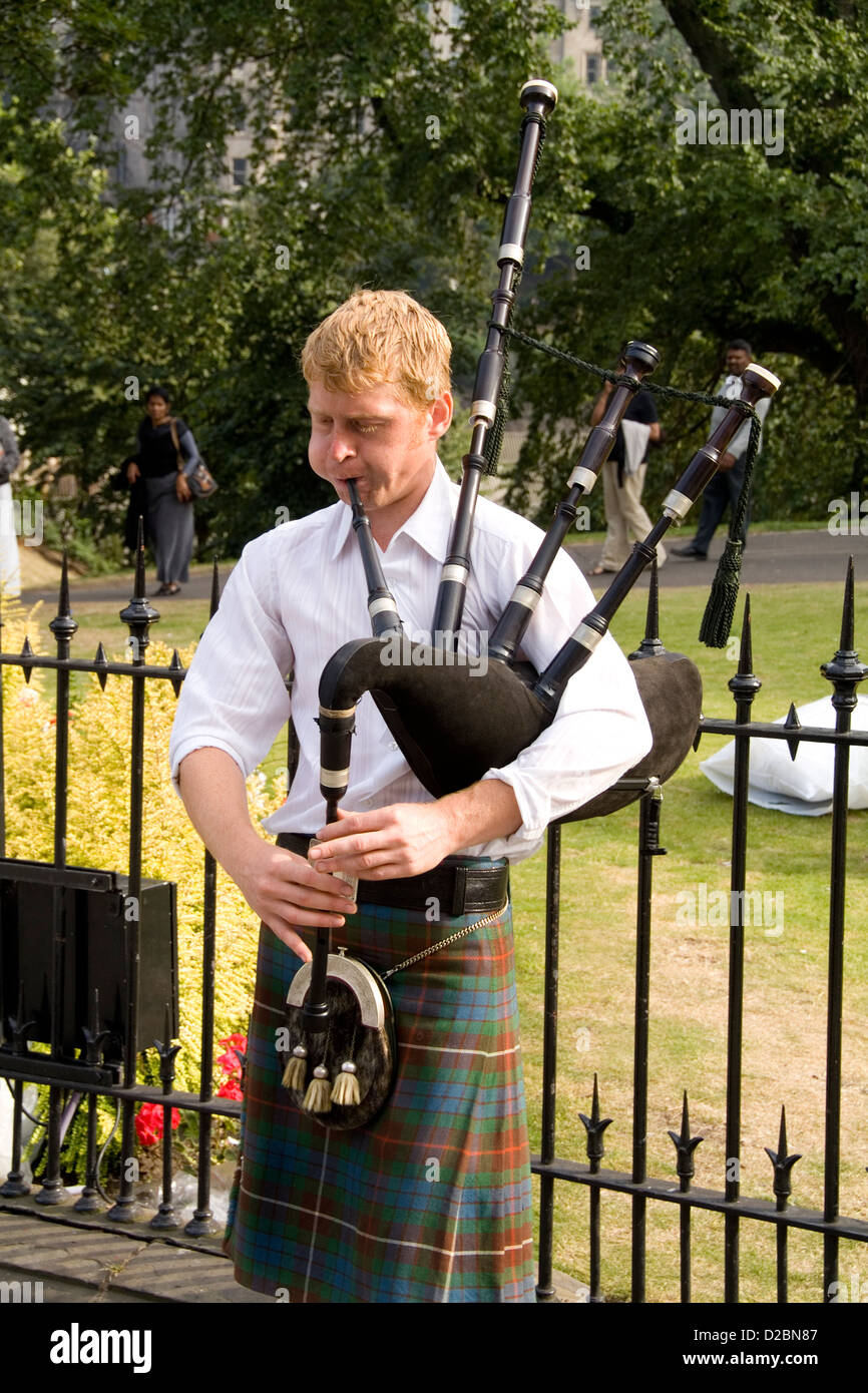 Young Man Playing Bagpipes In Capital Of Edinburgh Scotland Stock Photo