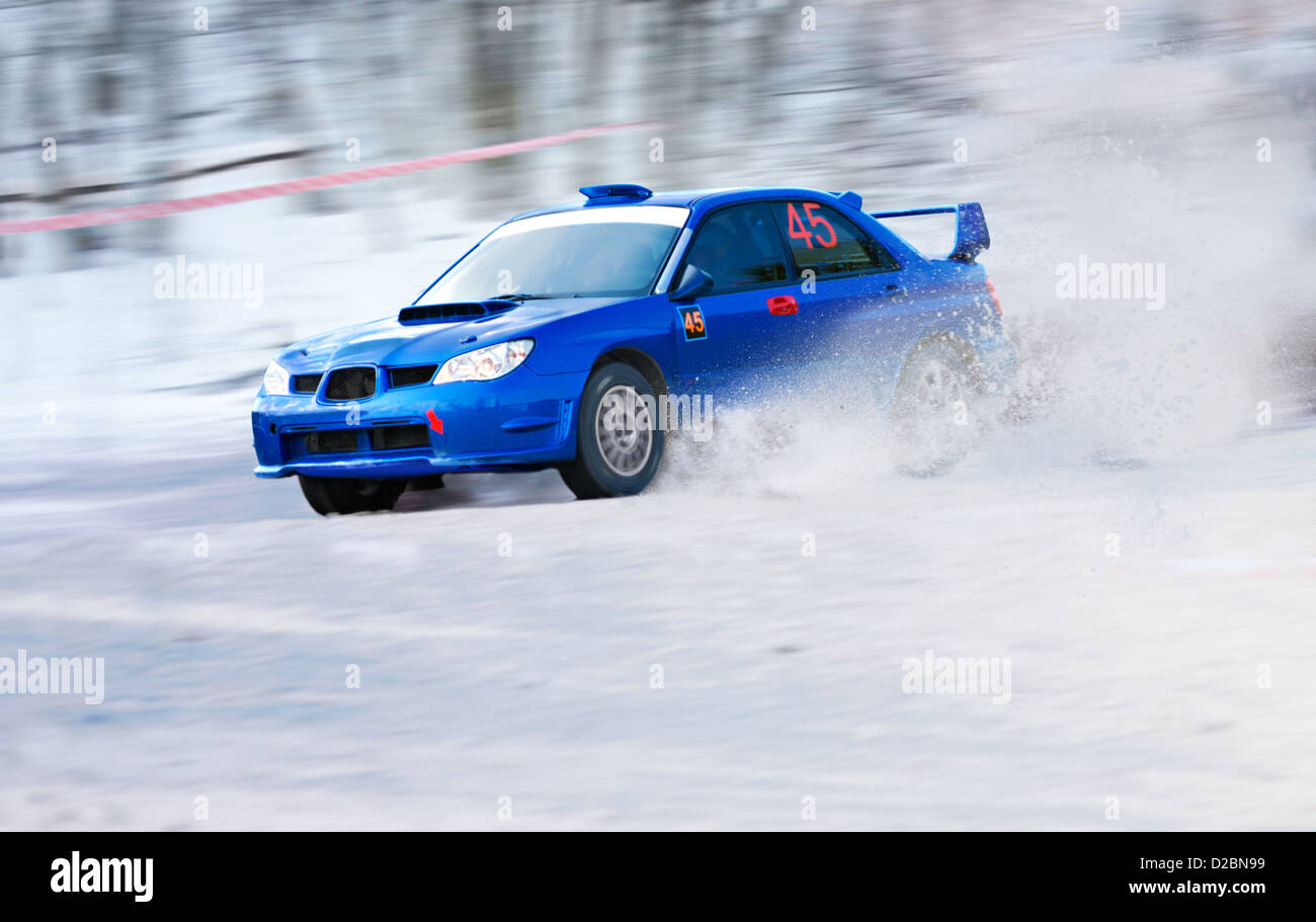 rally car, snowy road, blue Subaru Impreza, race Stock Photo