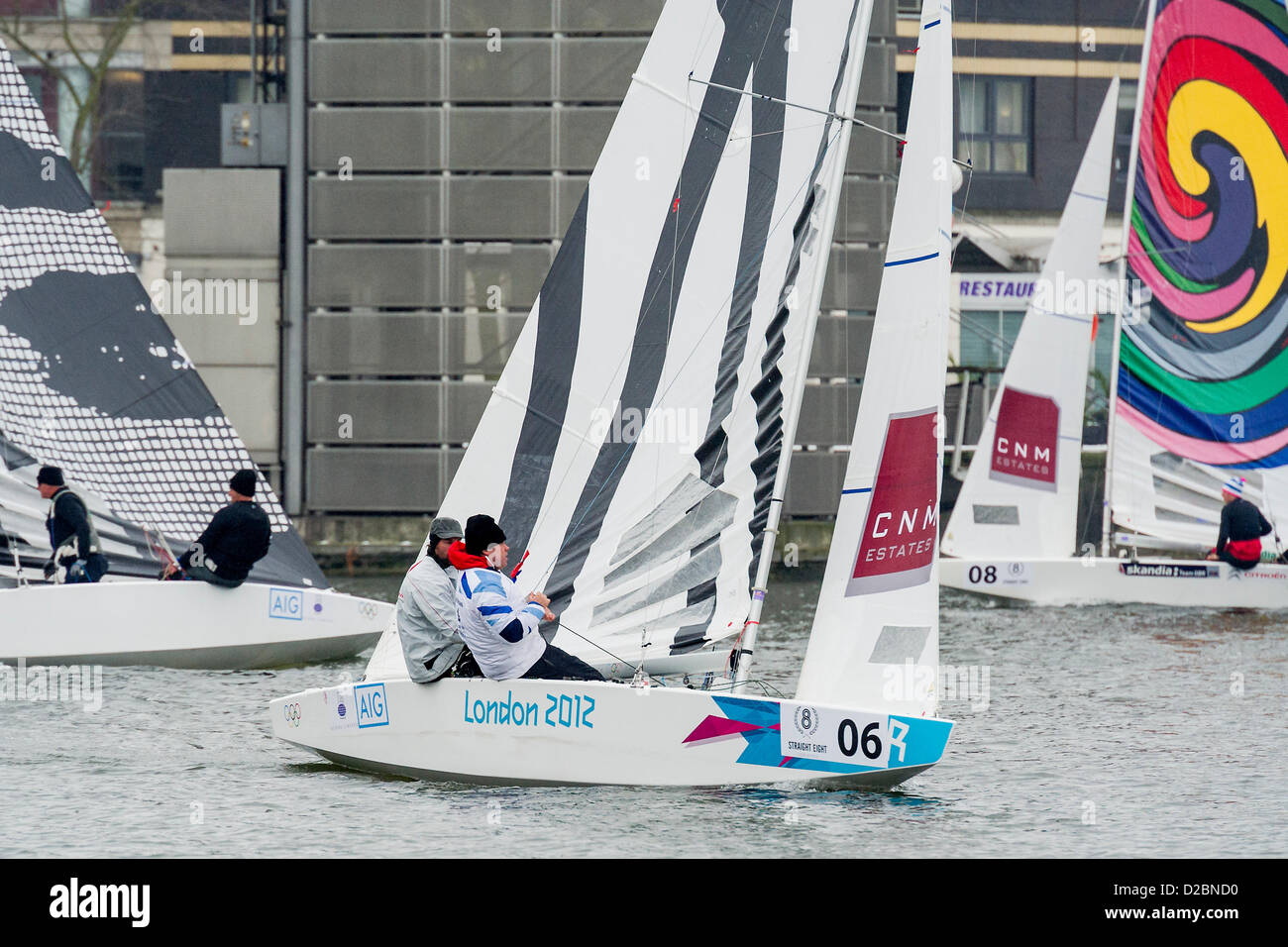Star Class boats are raced by 20 Olympic and World champion sailors – including triple Olympic medalist Iain Percy (pictured C), double Olympic medalist Andrew Simpson (pictured C), Olympic medalists Pippa Wilson, Ian Walker, Luke Patience and Xavier Rohart .  They are using boats with sails designed by a range of artists -  Eine, Julian Opie, Goldie and David Begbie. This is the first time sailing and art has been brought together in a match racing series. The London Boat Show, Excel centre, Docklands, London, UK 19 January 2013. Stock Photo