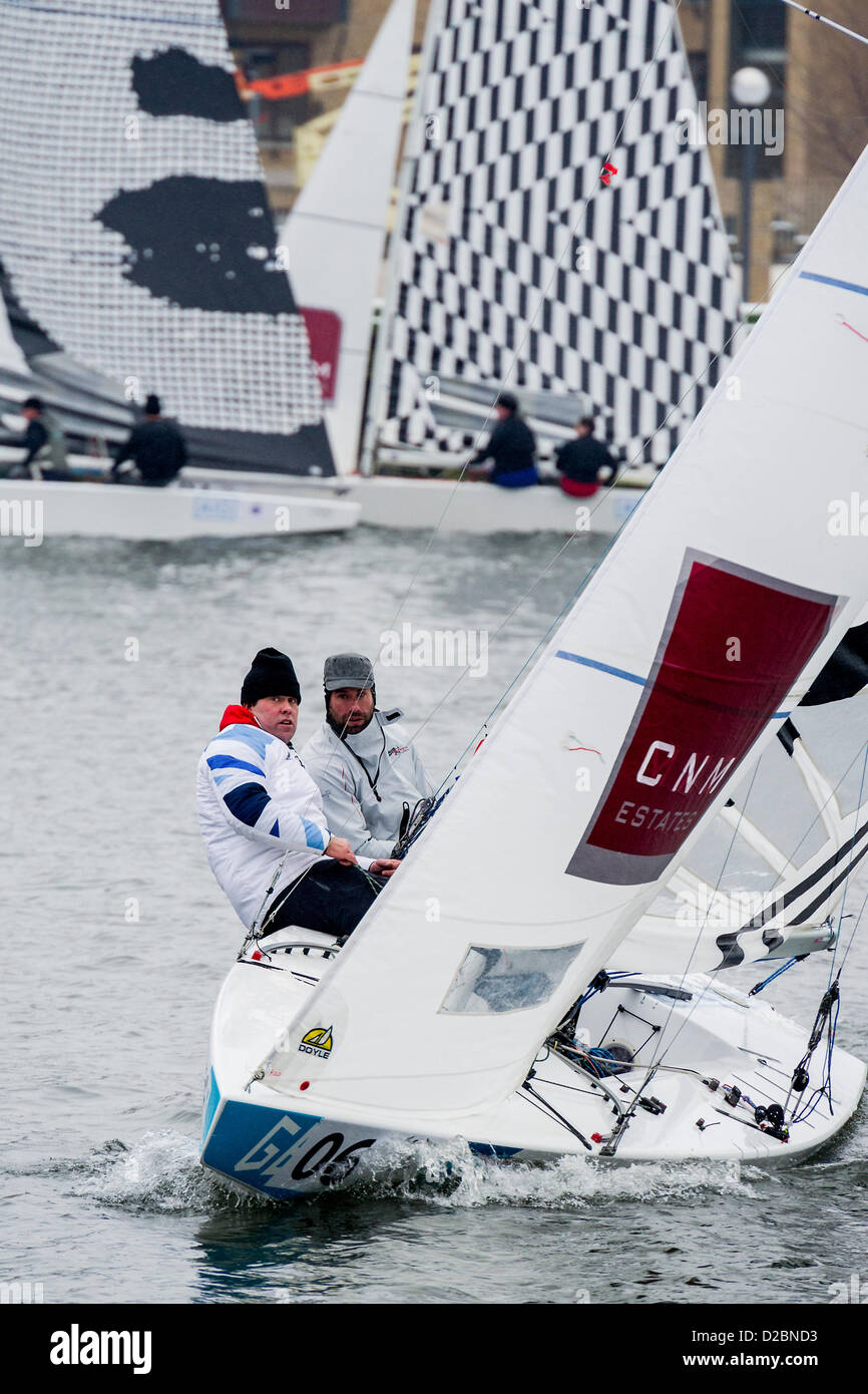 Star Class boats are raced by 20 Olympic and World champion sailors – including triple Olympic medalist Iain Percy (pictured C), double Olympic medalist Andrew Simpson (pictured C), Olympic medalists Pippa Wilson, Ian Walker, Luke Patience and Xavier Rohart .  They are using boats with sails designed by a range of artists -  Eine, Julian Opie, Goldie and David Begbie. This is the first time sailing and art has been brought together in a match racing series. The London Boat Show, Excel centre, Docklands, London, UK 19 January 2013. Stock Photo
