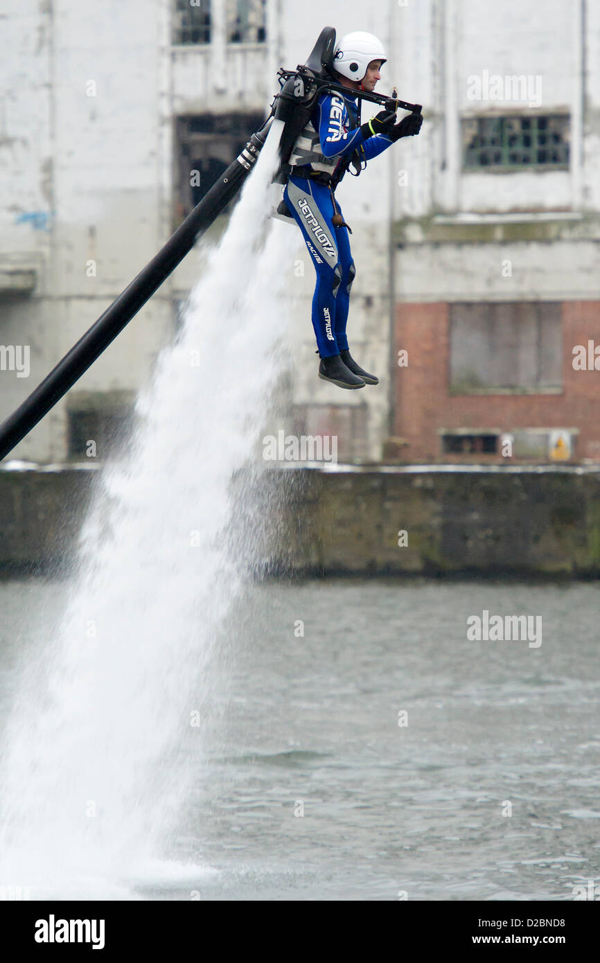 A water powered jet pack (Jet Lev) is piloted around the dock outside the show. The London Boat Show at the Excel Centre, Docklands, London, UK 19 January 2013. Stock Photo