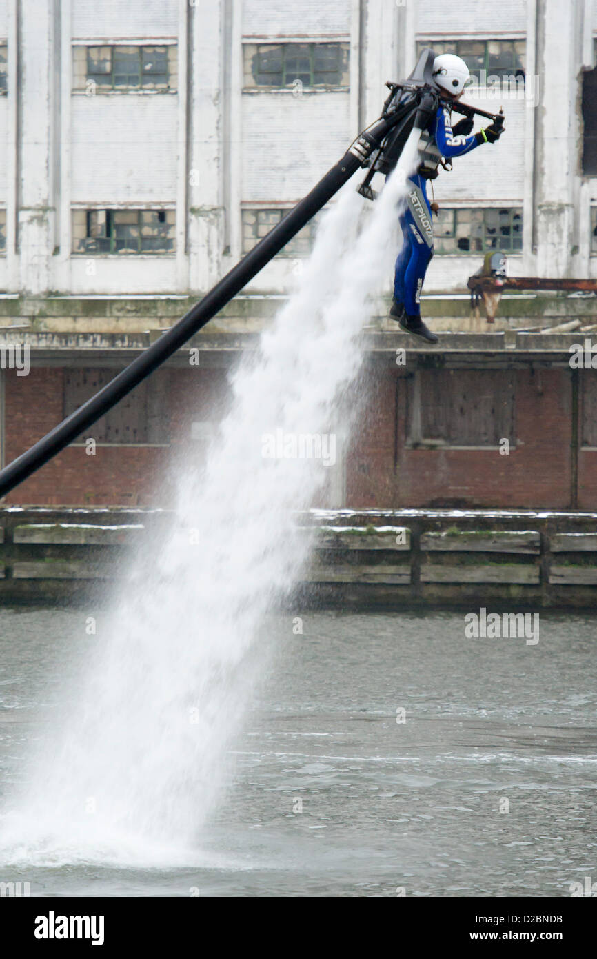 A water powered jet pack (Jet Lev) is piloted around the dock outside the show. The London Boat Show at the Excel Centre, Docklands, London, UK 19 January 2013. Stock Photo