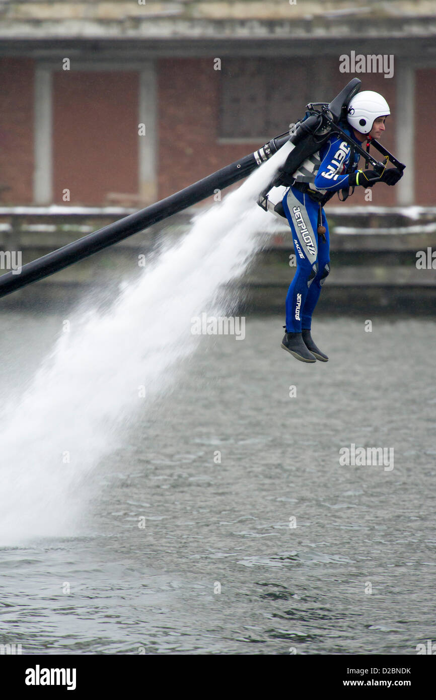 A water powered jet pack (Jet Lev) is piloted around the dock outside the show. The London Boat Show at the Excel Centre, Docklands, London, UK 19 January 2013. Stock Photo