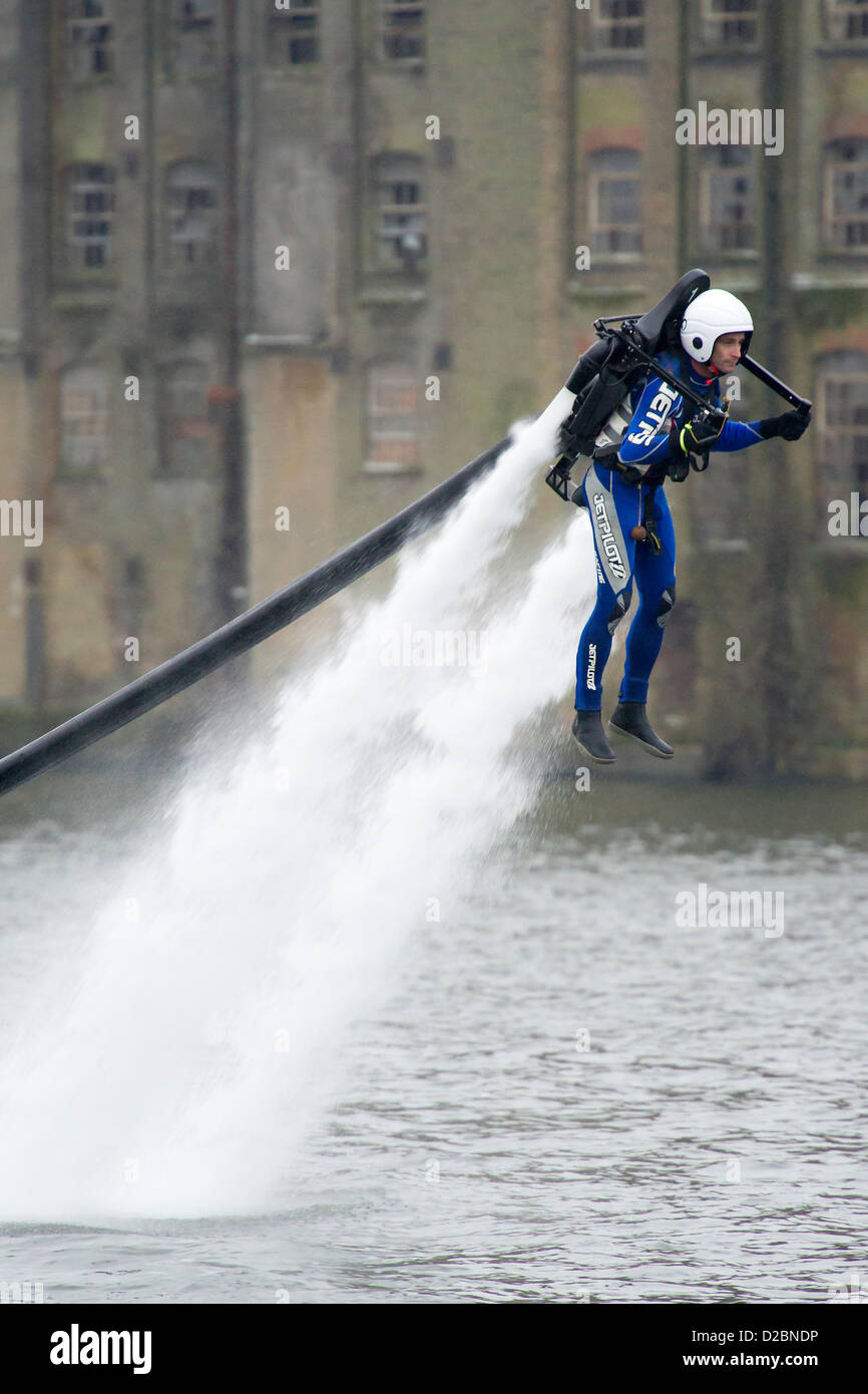 A water powered jet pack (Jet Lev) is piloted around the dock outside the show. The London Boat Show at the Excel Centre, Docklands, London, UK 19 January 2013. Stock Photo