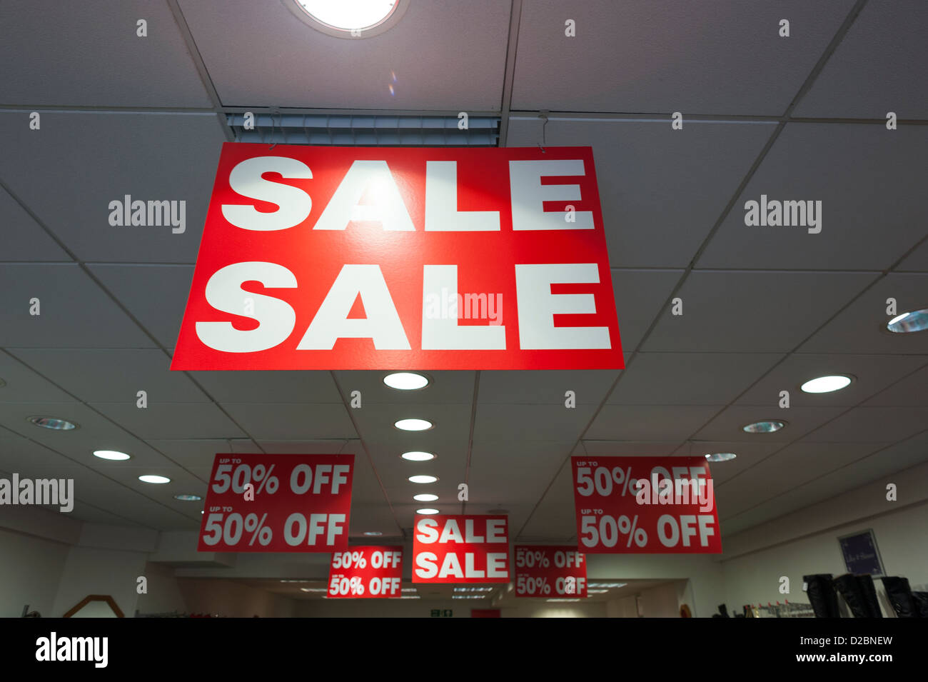 Sale Signs Hanging From High Street Shop Ceiling Stock Photo