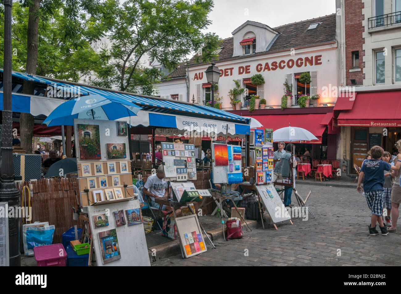 Paintings for sale in the Place du Tertre with Sacre Coeur Basilica in distance, Montmartre