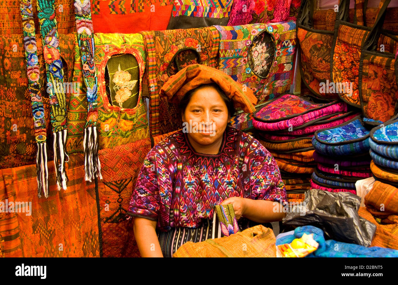Woman Selling Artwork In Chichicastenango, Guatemala Stock Photo