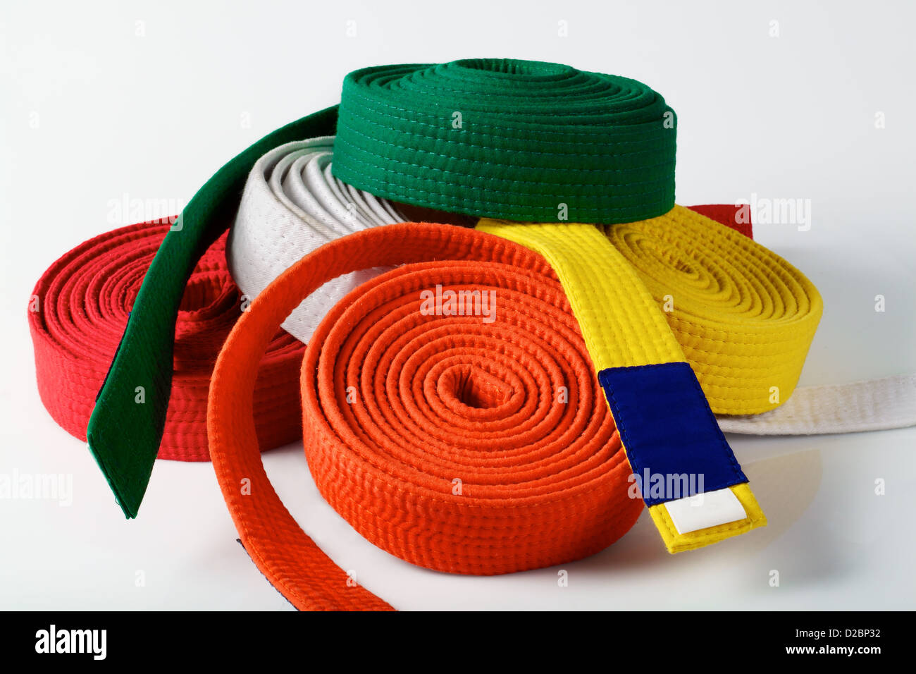 Colored karate belts on white Stock Photo