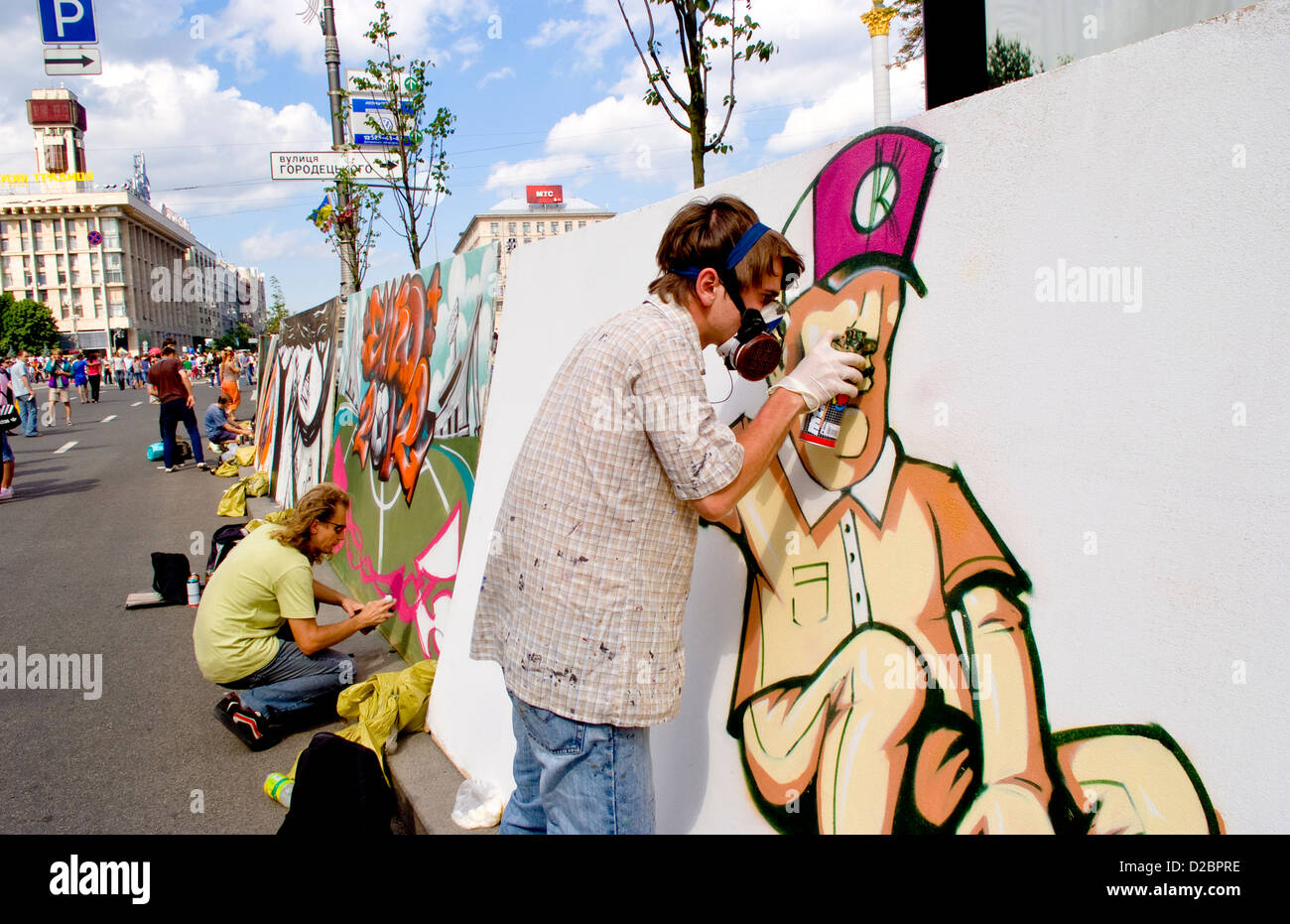 Artists Spray Painting Artwork At Street Festival In Kiev, Ukraine. Stock Photo