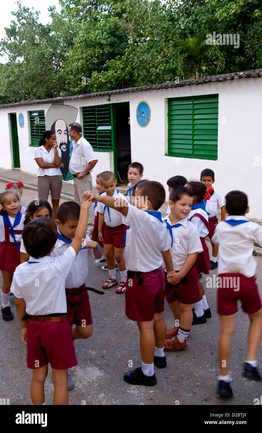 Group Of Students In School In Las Terrazas In Sierra Del Rosario, Cuba, With Mural Of Fidel Castro. Stock Photo